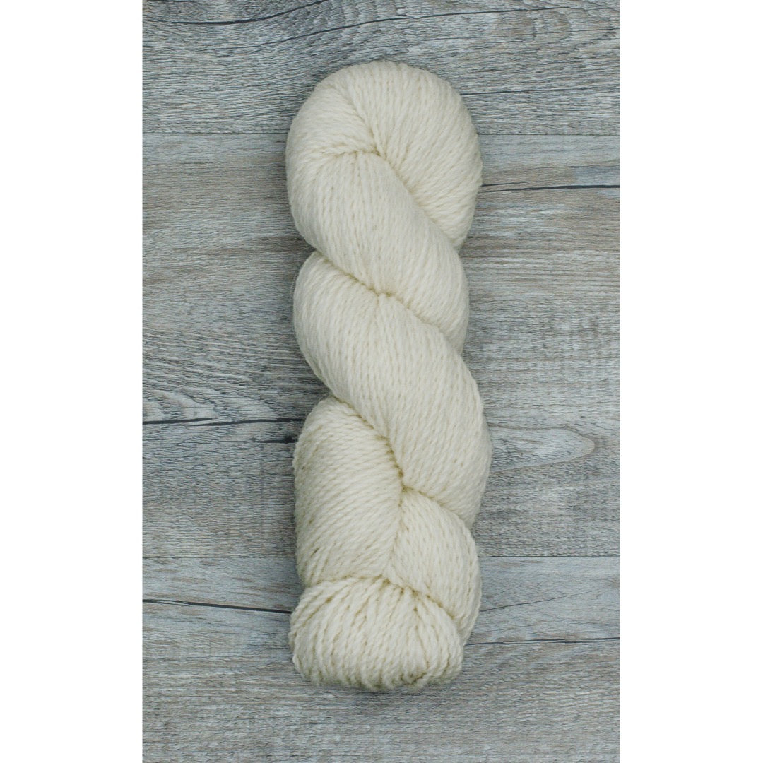 One hank of Como Classic yarn in a creamy white