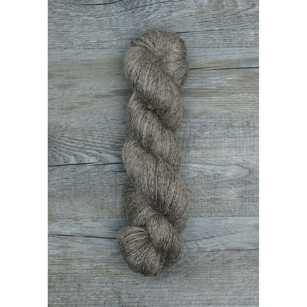 One full hank of shiny dark grey mohair fingering yarn