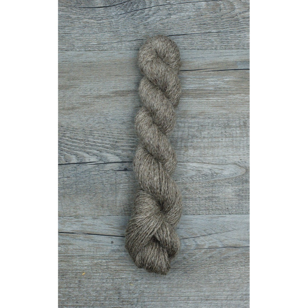 One half hank of shiny dark grey mohair fingering yarn