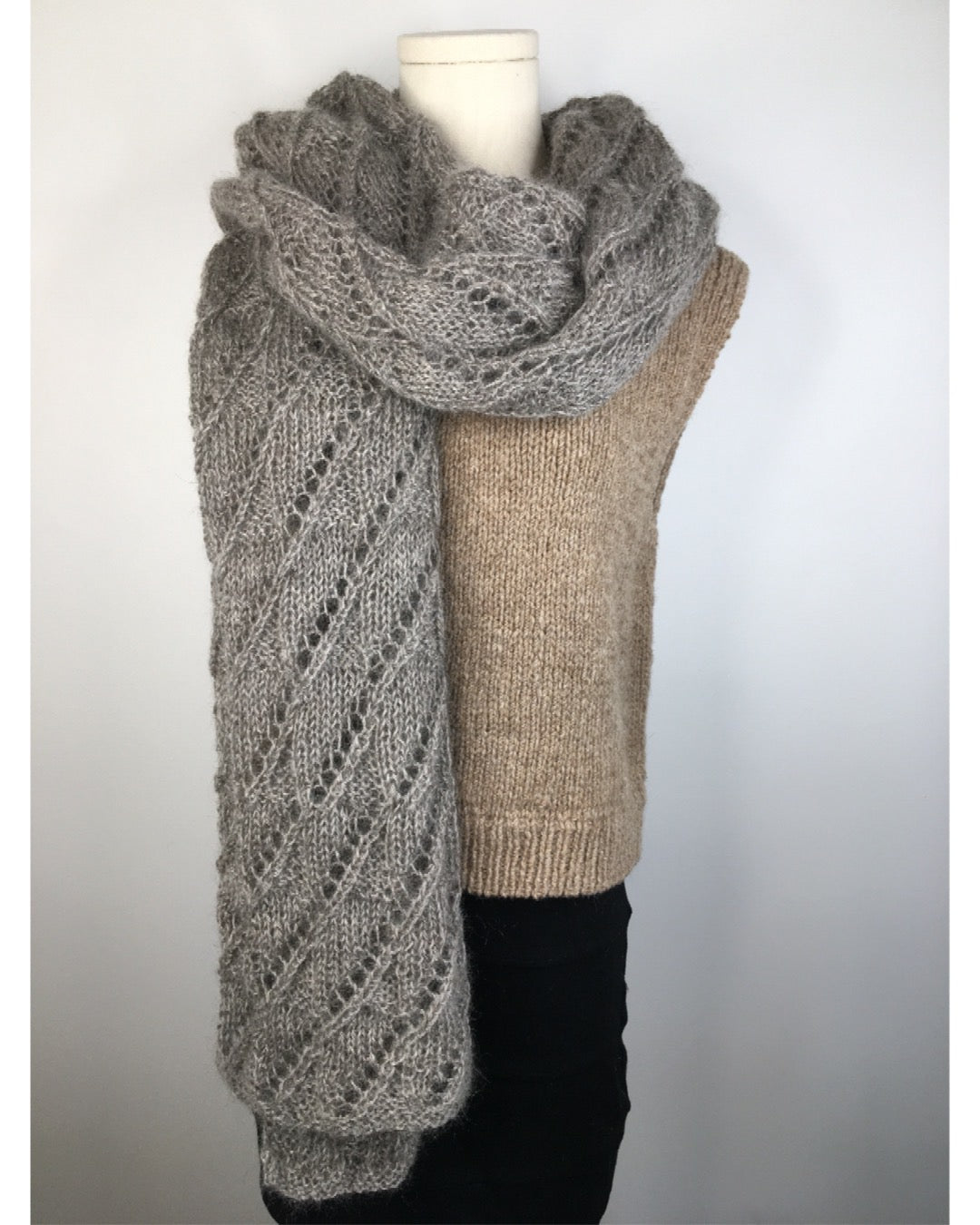 A lace scarf knit in Mohair DK draped over a mannequin
