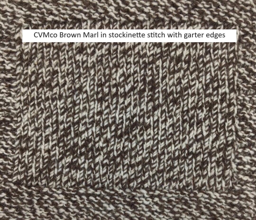 Close-up view of knitted swatch in marled dark brown and white  CVMco yarn