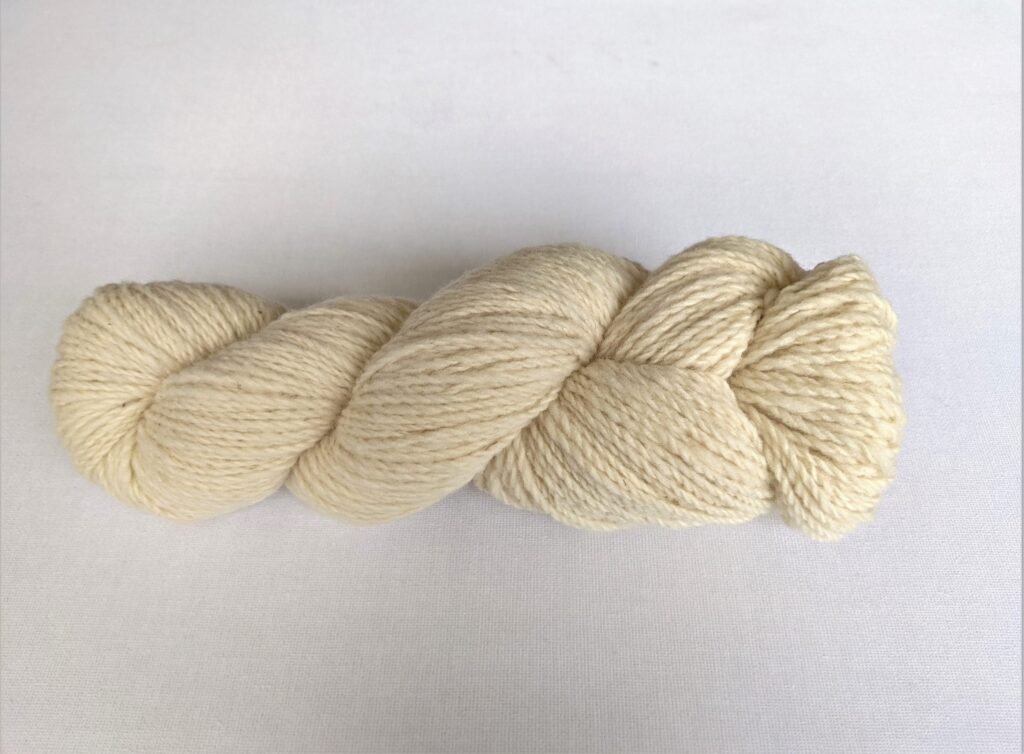 One hank of light beige CVMco worsted weight yarn