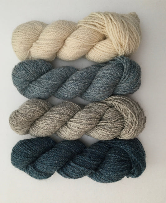 Four hanks of Como Classic yarn in different colours