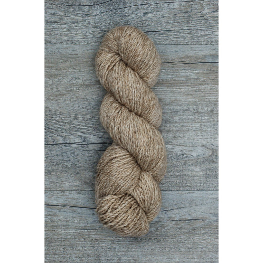 One hank of Copaca worsted in heathered medium red-brown