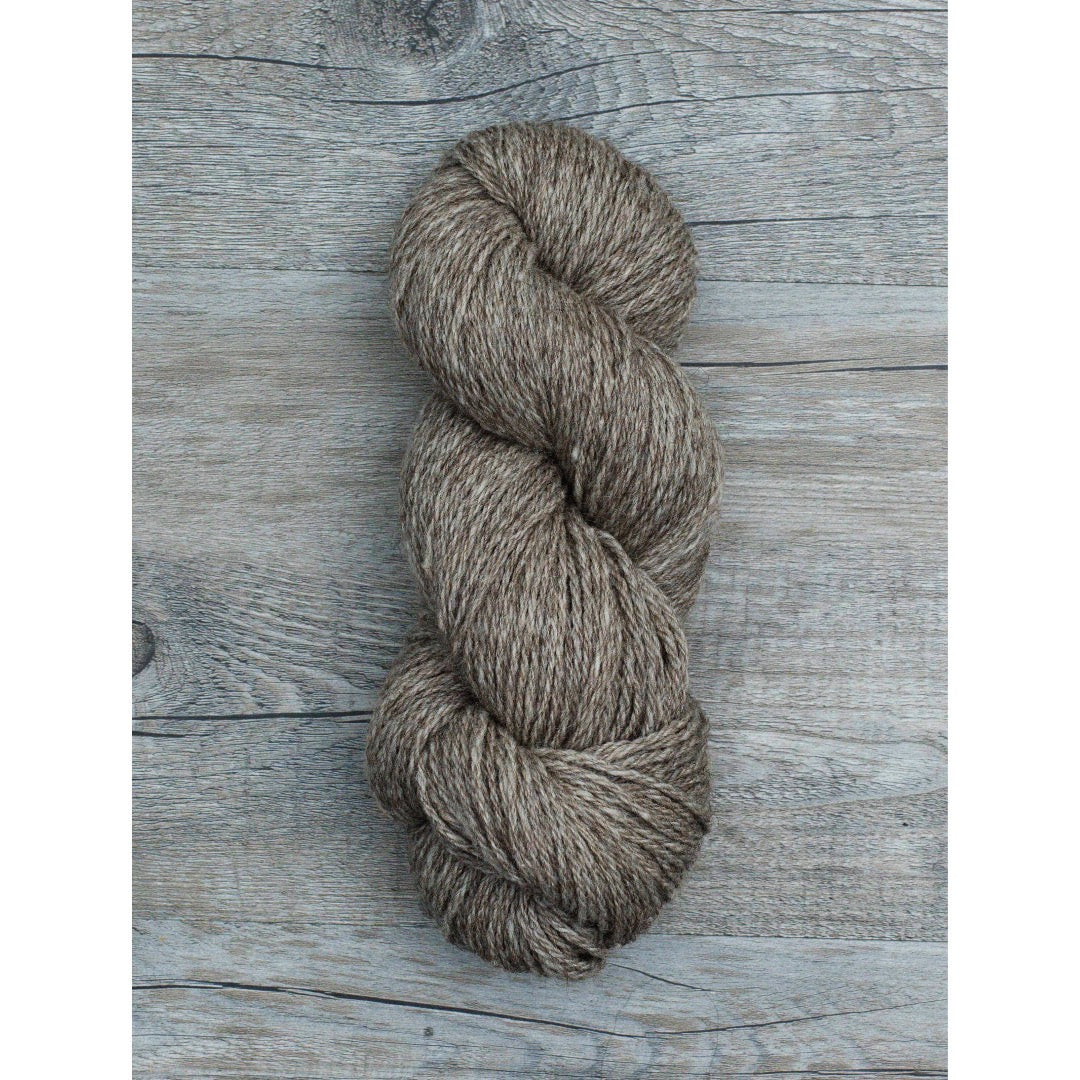 One half hank of ginger brown coloured Copaca DK yarn