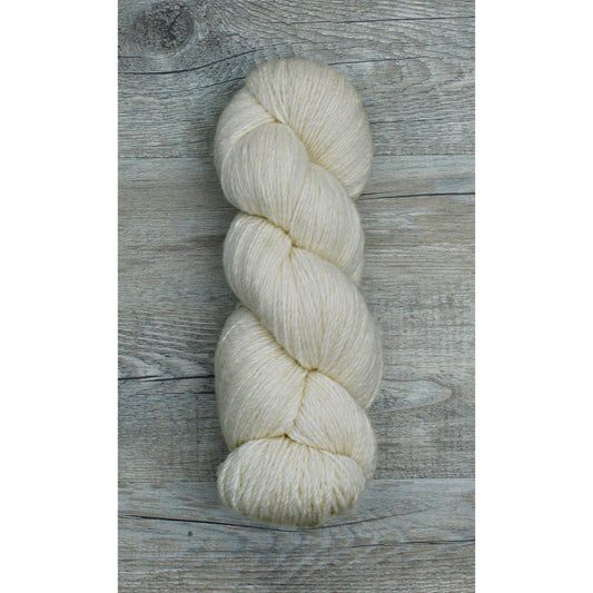 One hank of light beige lofty fingering yarn