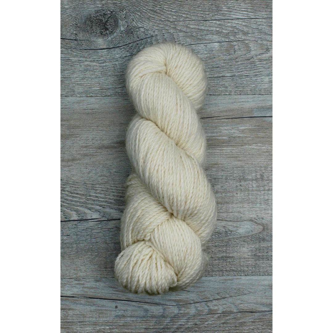 One hank of creamy white Corriedale worsted weight yarn