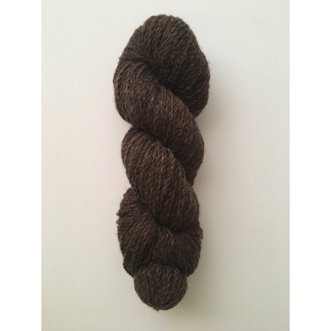 One hank of undyed dark brown worsted weight wool yarn