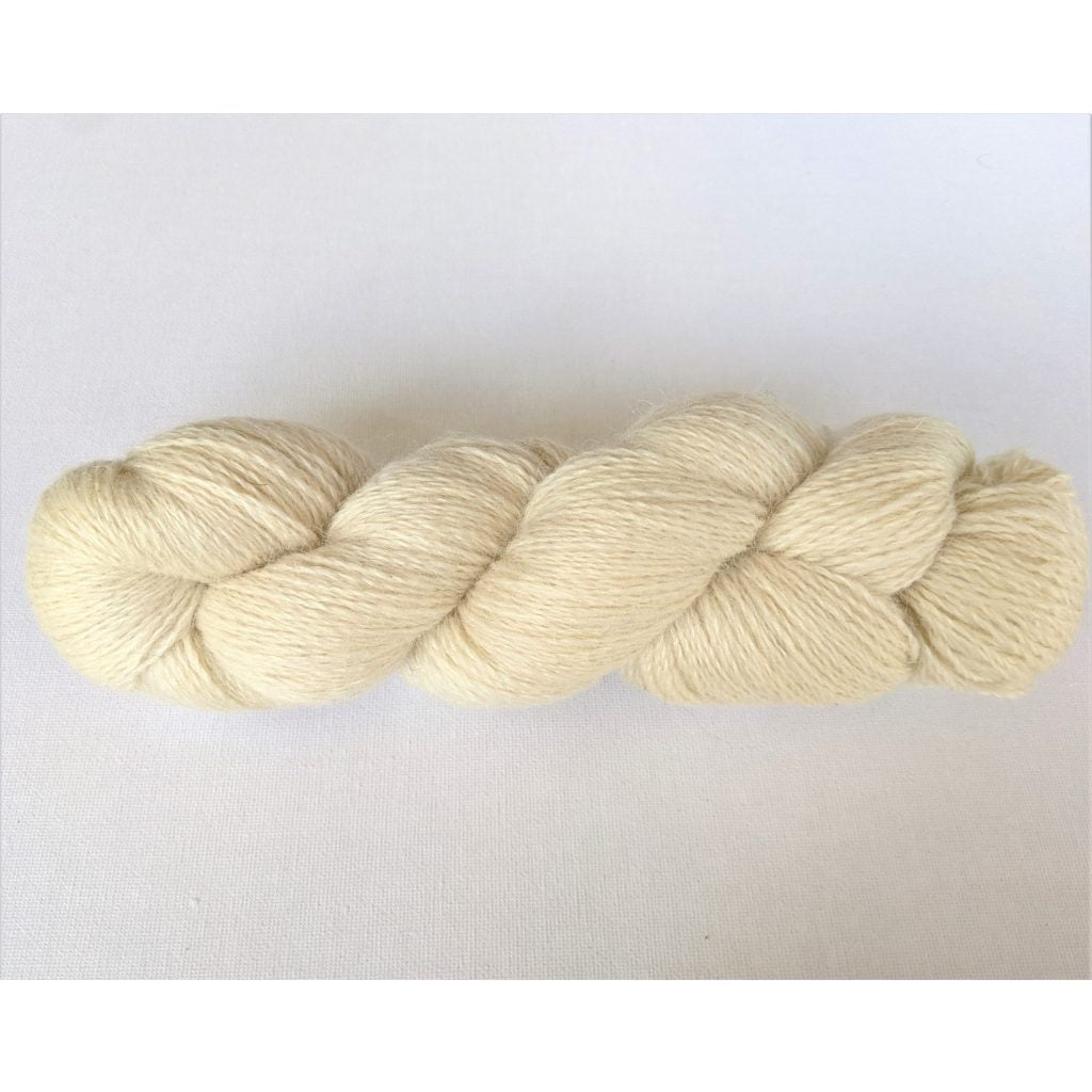 One soft white coloured hank of Moco Fingering yarn