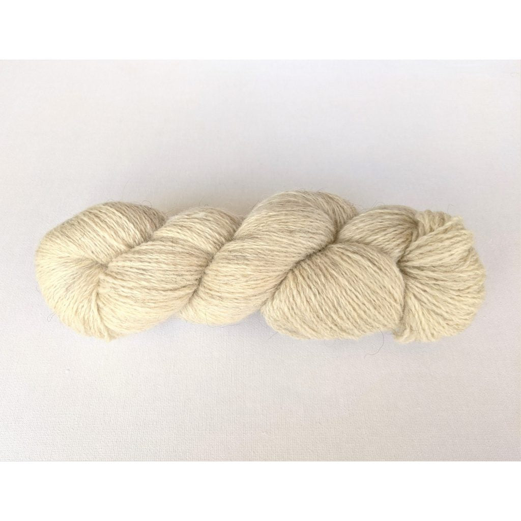 One beige coloured hank of Moco Fingering yarn