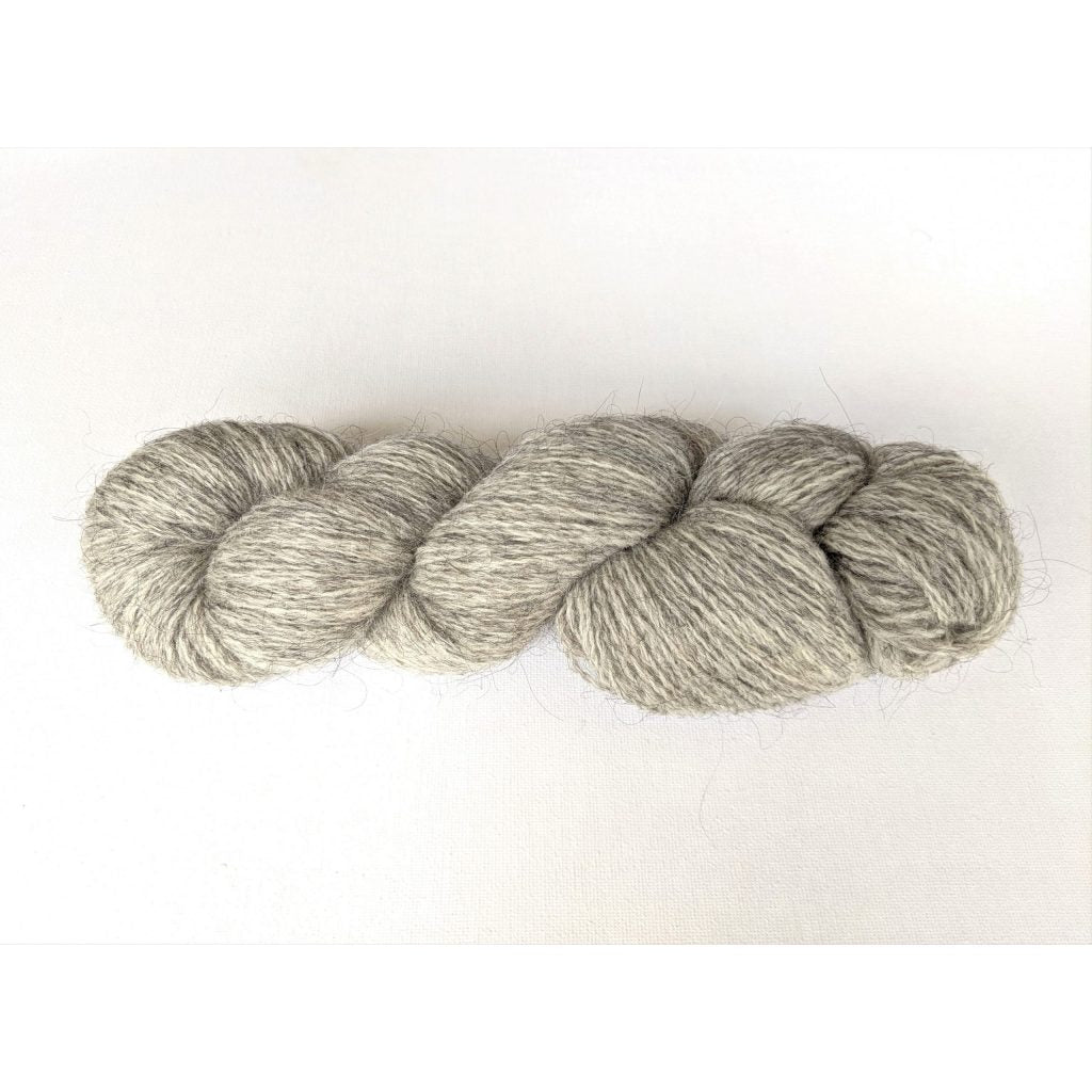 One heather grey coloured hank of Moco Fingering yarn
