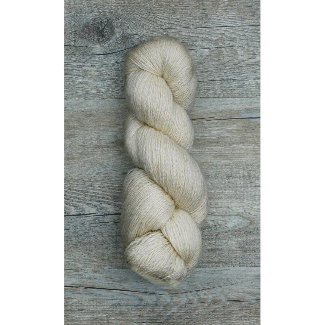 One soft white coloured hank of Moco Fingering yarn