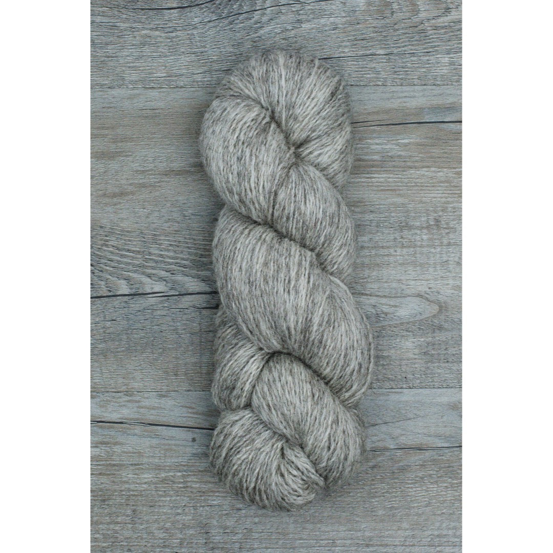 One cool medium grey coloured hank of Moco Fingering yarn