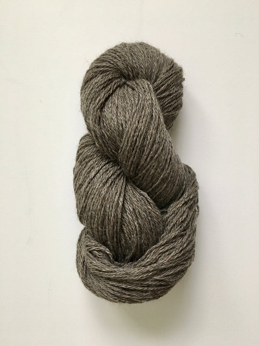 One hank of dark grey silvery coloured light worsted yarn