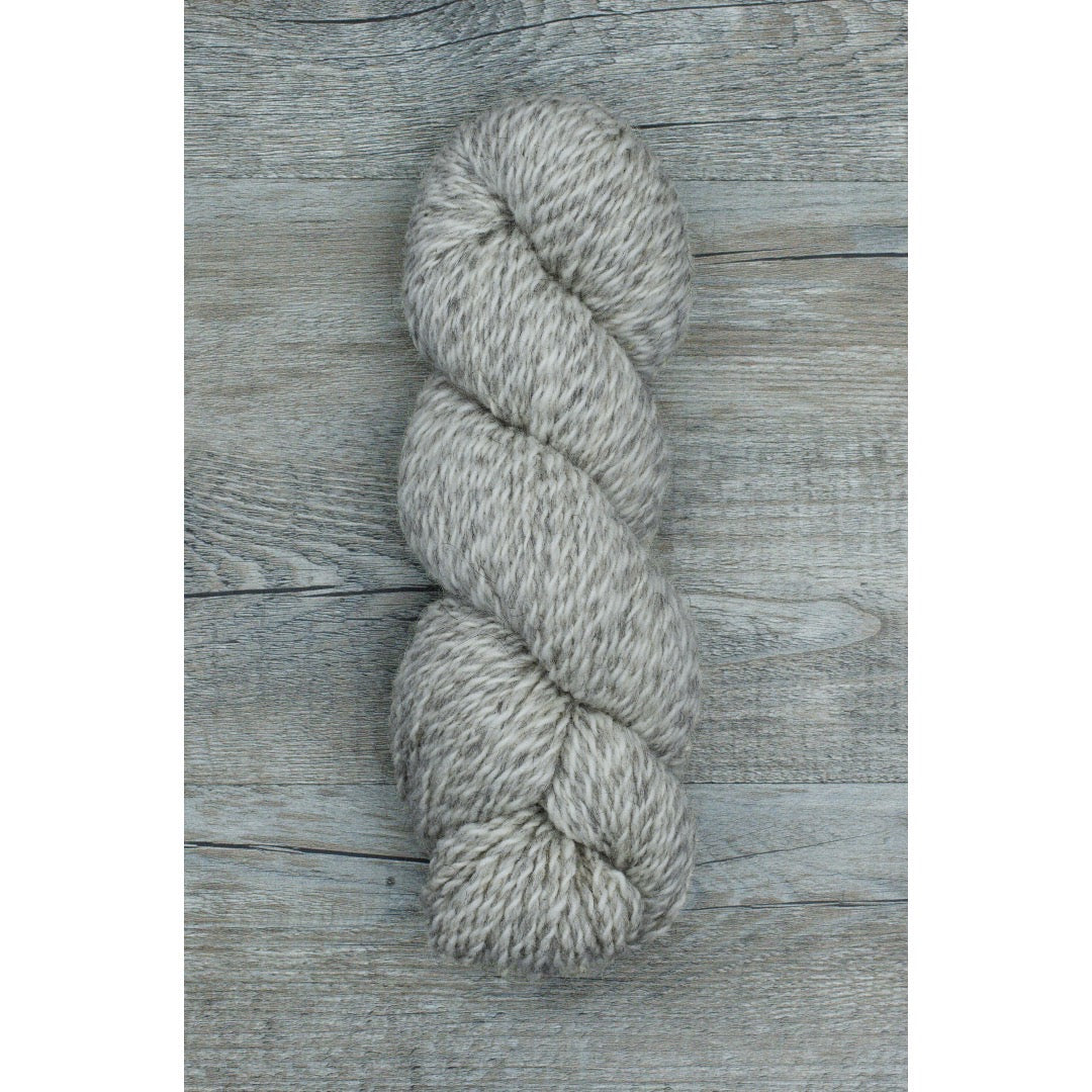 One hank of marled cool grey and white Ramo worsted weight yarn