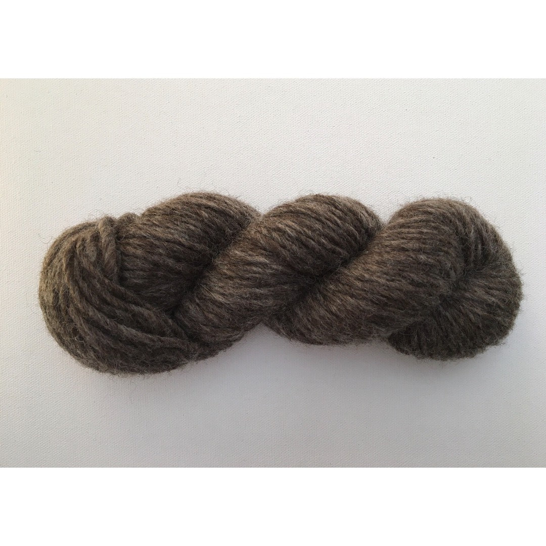 One natural coloured dark brown hank of Romney Bulky yarn