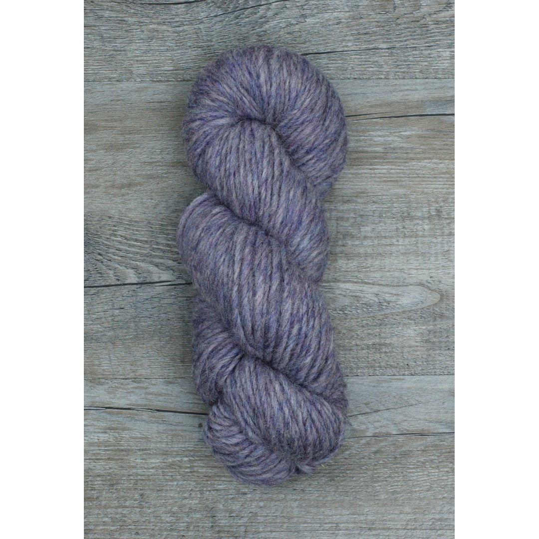 One hank of Romney Bulky yarn in Lilac colorway.