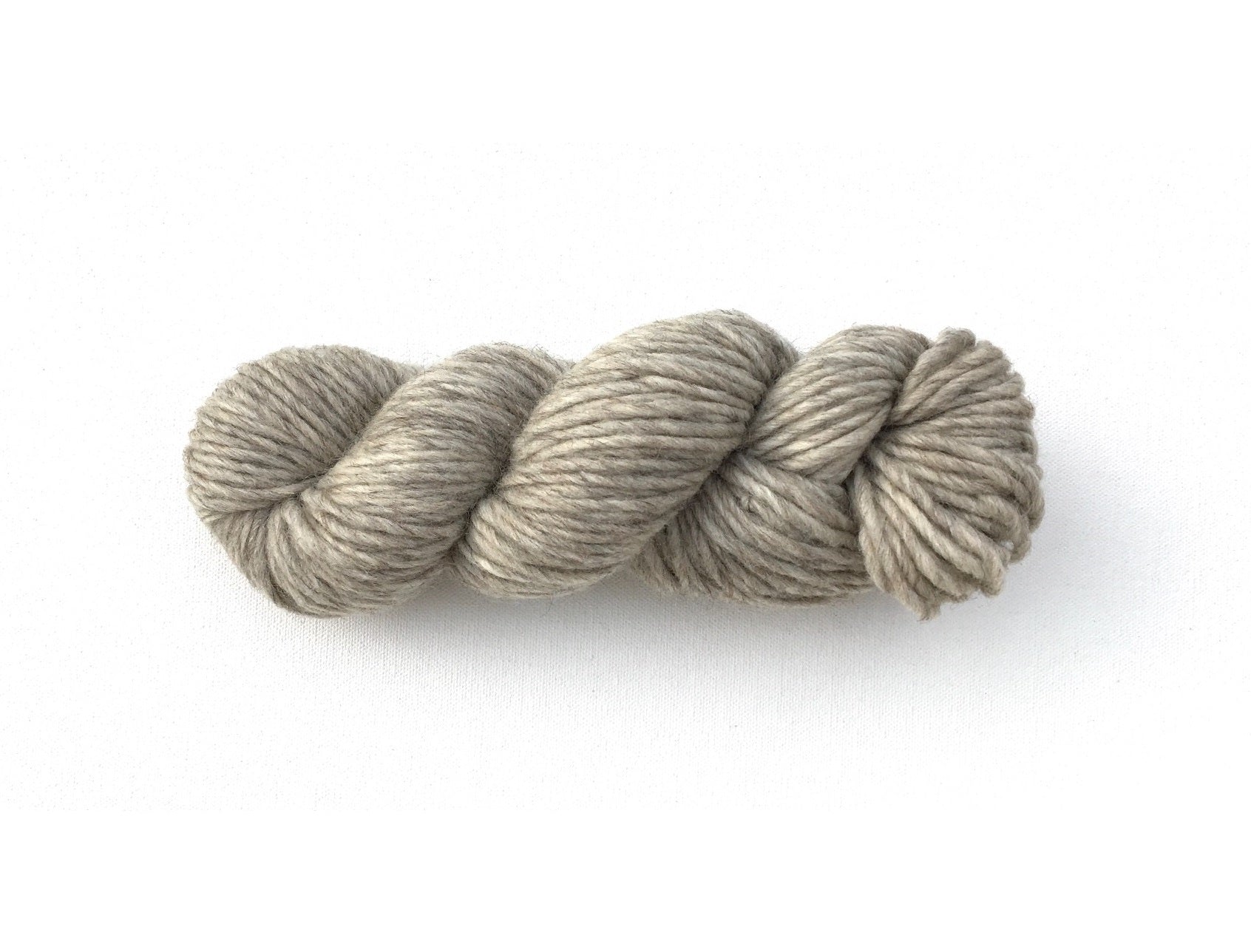 One hank of Roram Bulky yarn in natural light cool silvery grey