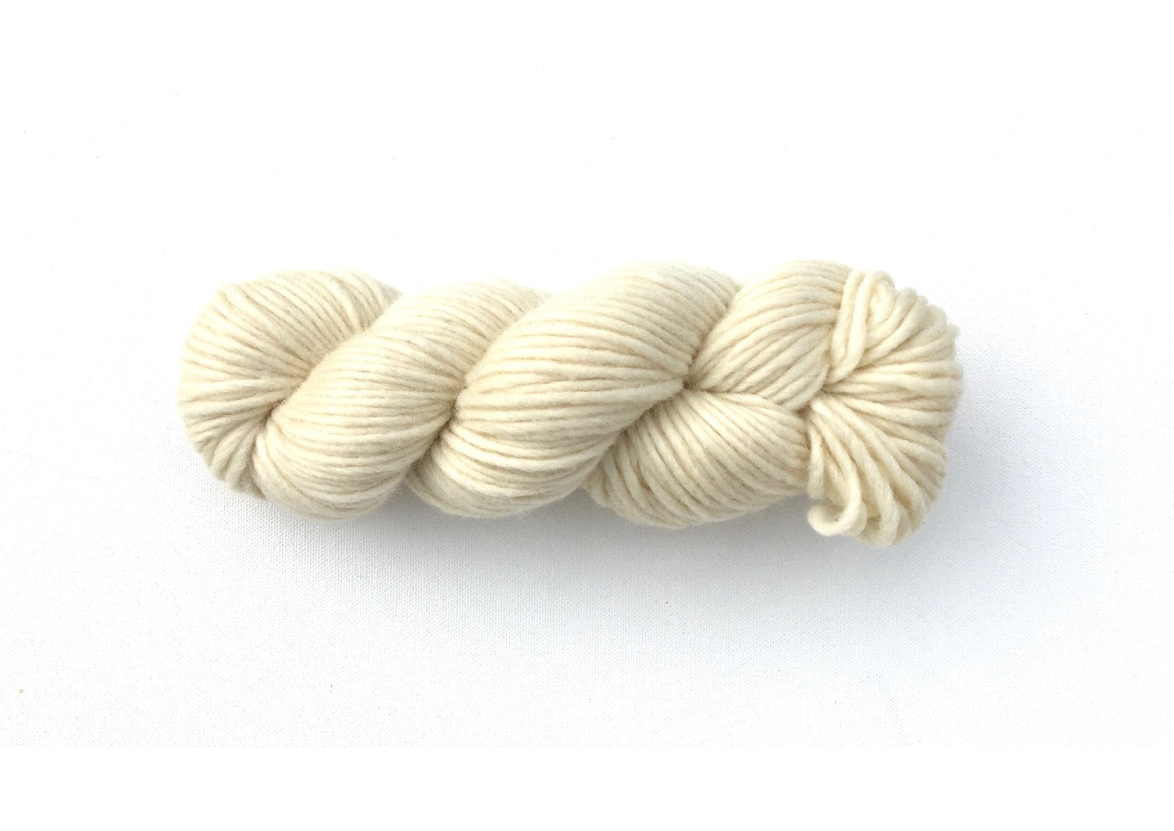 One hank of Roram Bulky yarn in natural cream colour