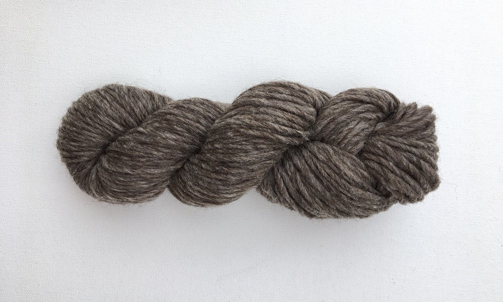 One hank of Roram Bulky yarn in natural grey with brown undertones