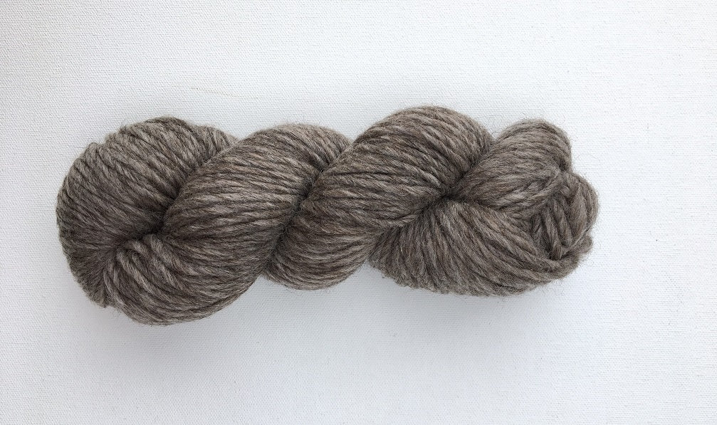 One hank of Roram Bulky yarn in natural cool dark grey