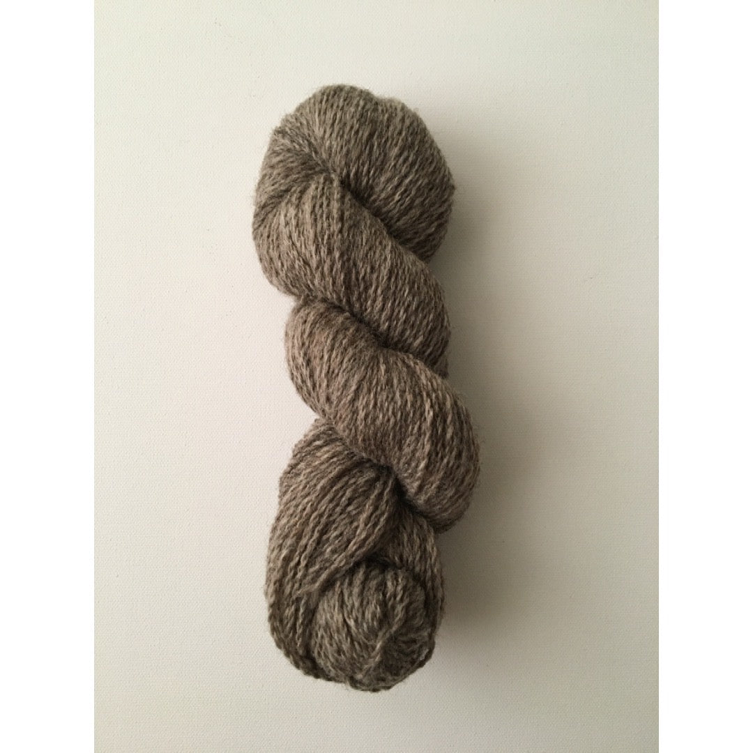 One hank of undyed dark grey worsted weight wool yarn